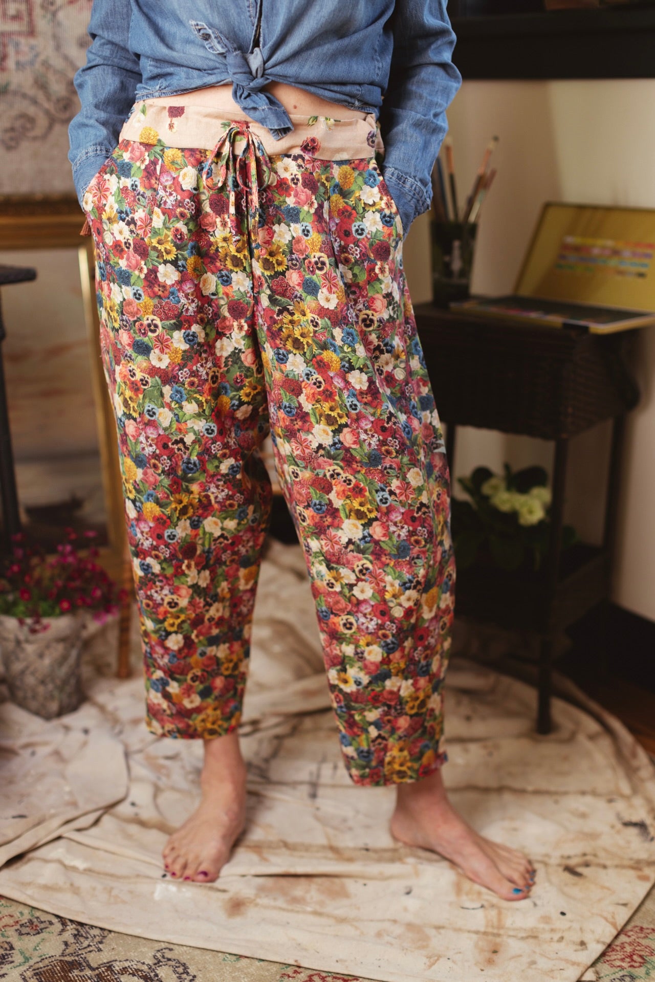 Artist pants featuring a whimsical print of 50 antique seed catalogue flowers arranged on a painter’s palette with a Monet quote – Market of Stars.
