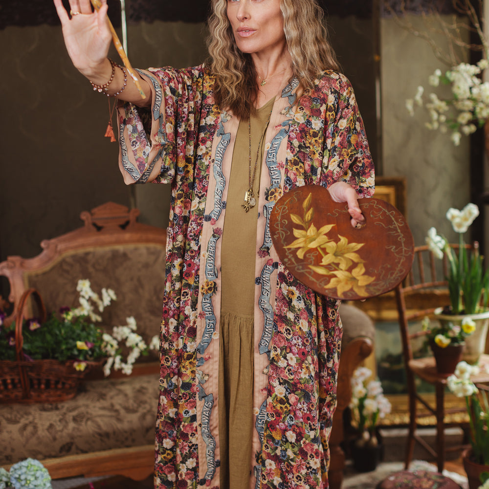 
                  
                    Opera-length kimono featuring an artist’s palette with over 50 antique seed catalogue flowers, inspired by Claude Monet’s love of flowers – Market of Stars
                  
                