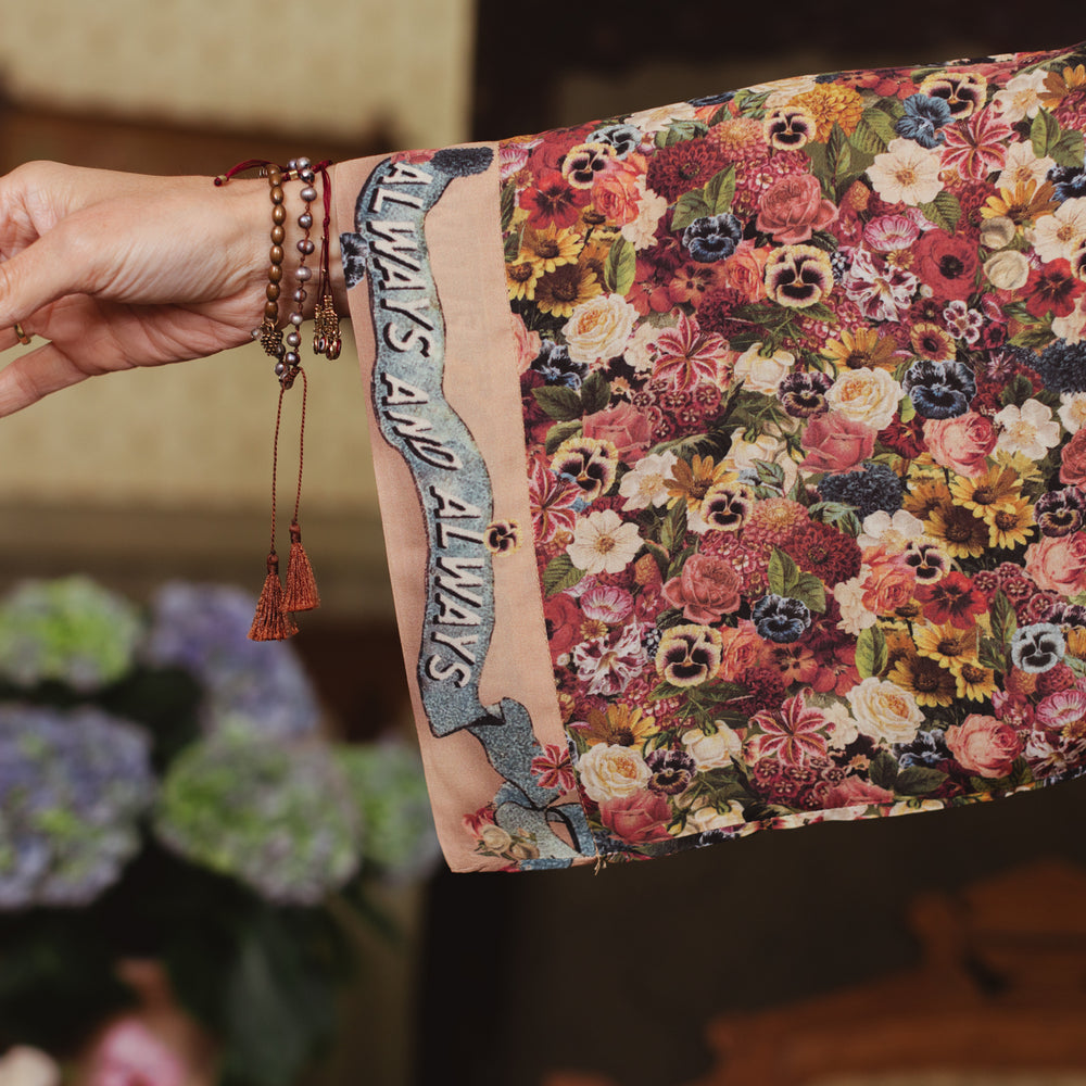 
                  
                    Opera-length kimono featuring an artist’s palette with over 50 antique seed catalogue flowers, inspired by Claude Monet’s love of flowers – Market of Stars
                  
                