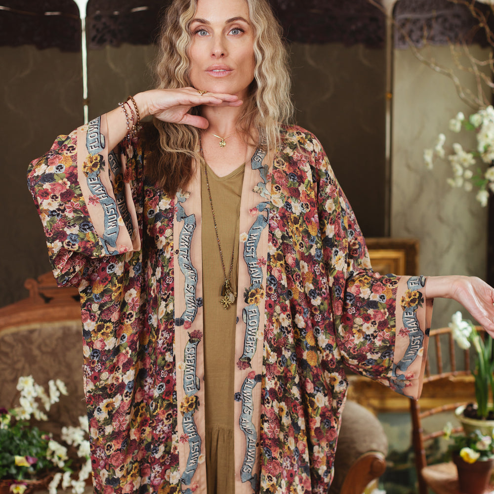 
                  
                    Opera-length kimono featuring an artist’s palette with over 50 antique seed catalogue flowers, inspired by Claude Monet’s love of flowers – Market of Stars
                  
                