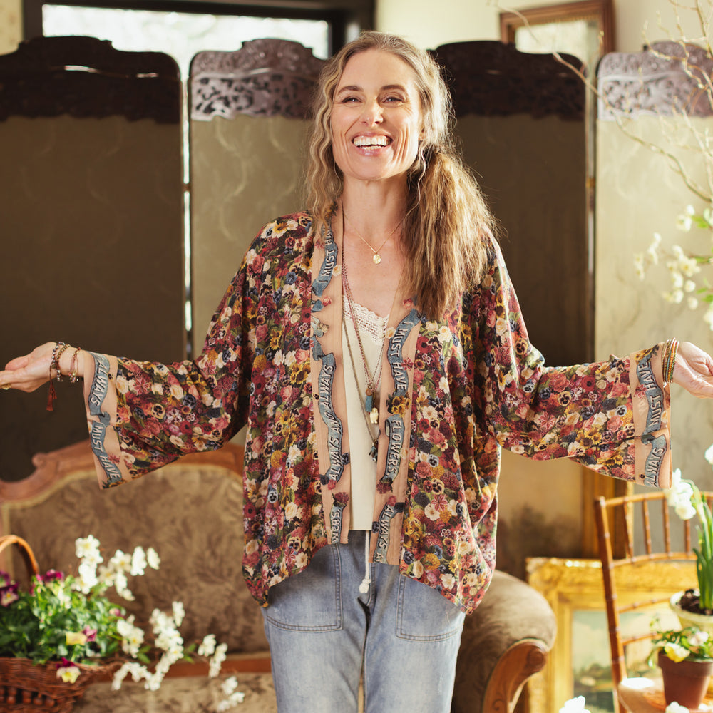 Short kimono featuring a whimsical artist’s palette and over 50 layered flowers from antique seed catalogues, inspired by Claude Monet – Market of Stars.