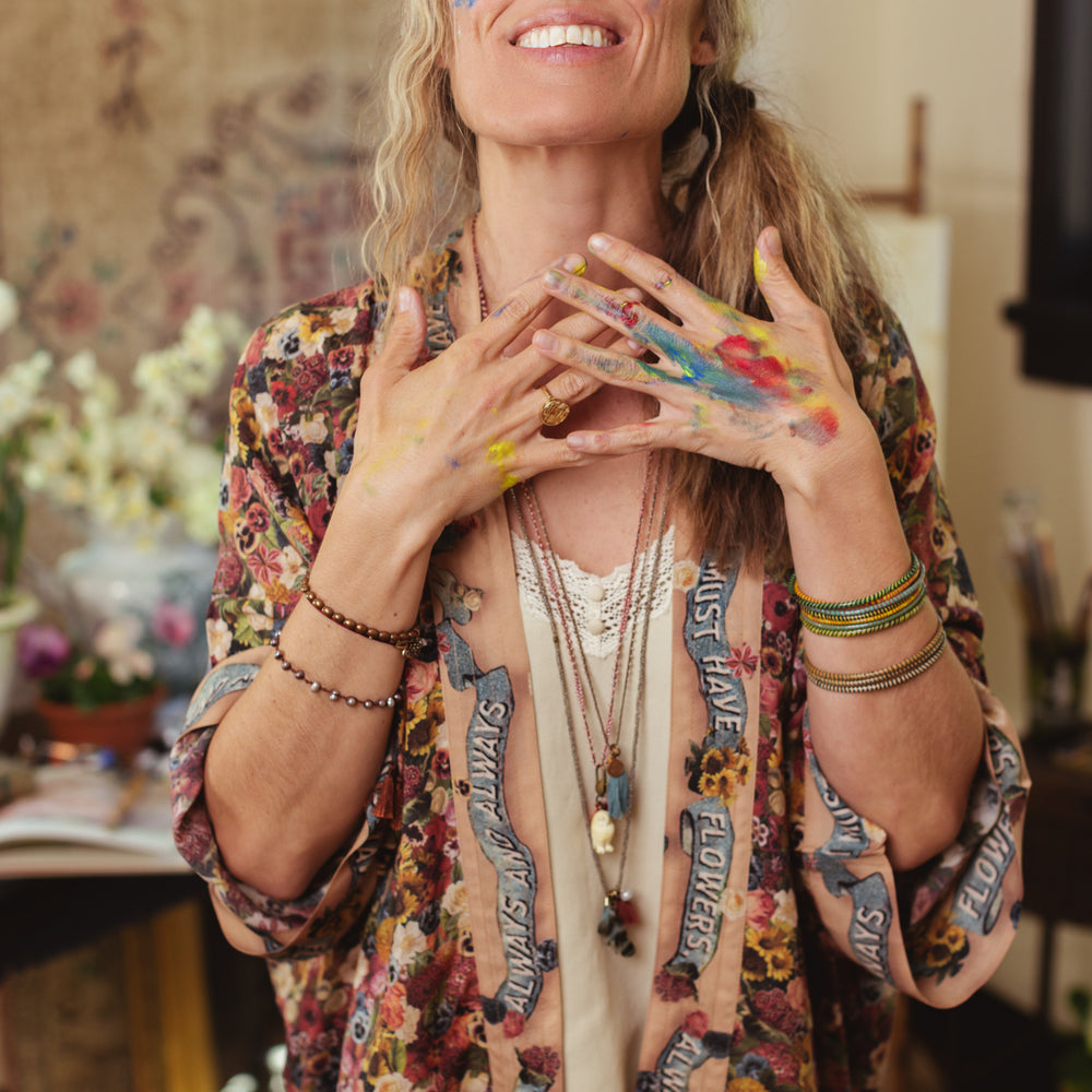 
                  
                    Short kimono featuring a whimsical artist’s palette and over 50 layered flowers from antique seed catalogues, inspired by Claude Monet – Market of Stars.
                  
                