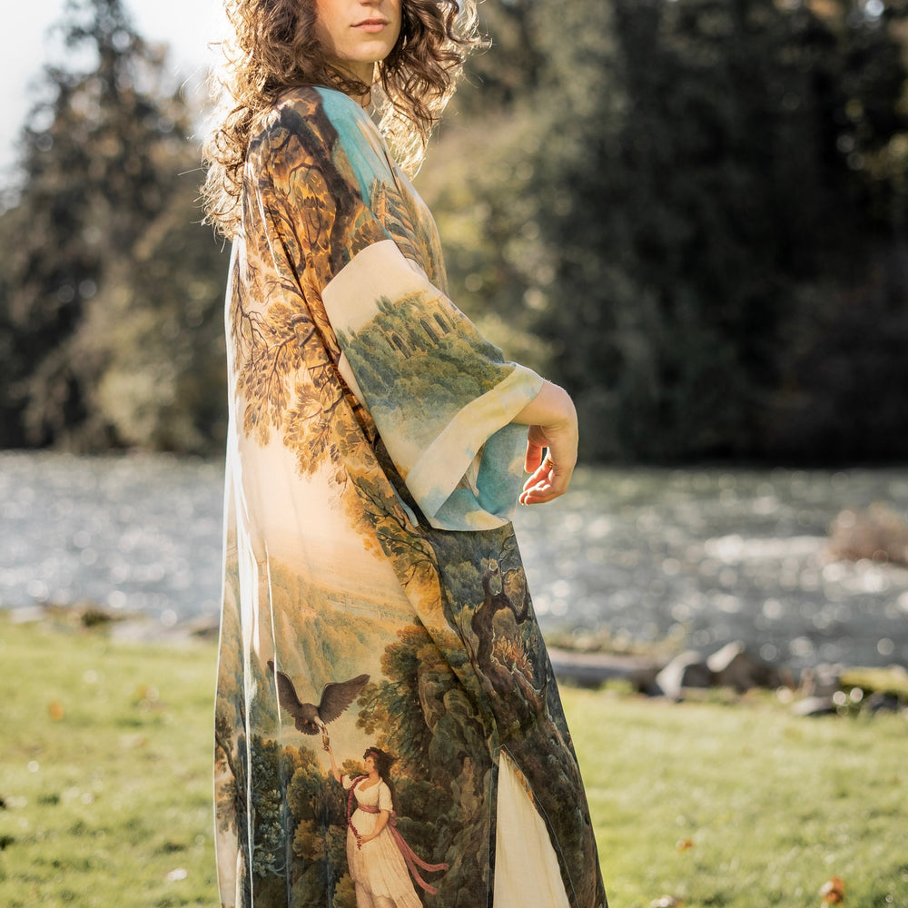
                  
                    Romantic kimono featuring 18th-century Tivoli waterfalls and Lady Liberty art in a soft, painterly palette celebrating strength and self-love – Market of Stars.
                  
                