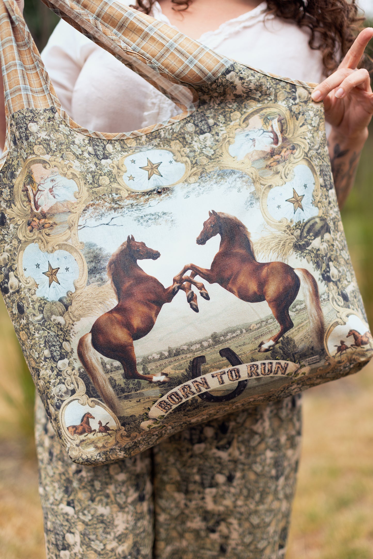 Model wearing a linen tote bag for everyday adventures with a whimsical print celebrating one's unbridled spirit of adventure - Market of Stars