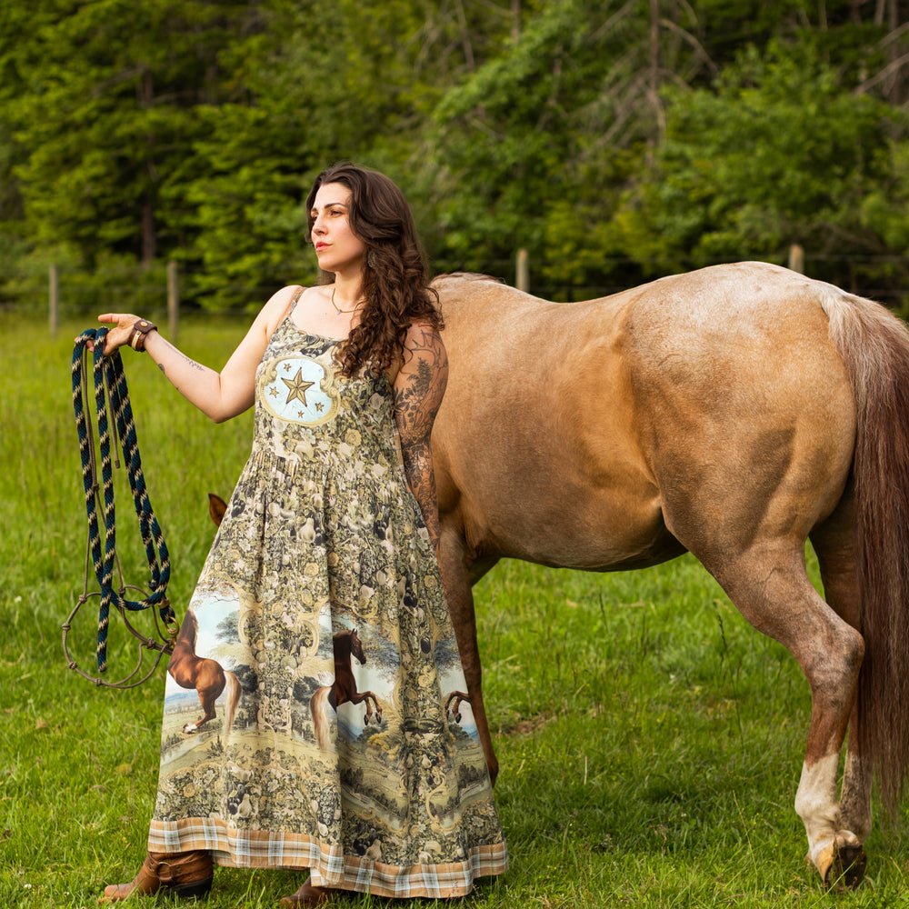 
                  
                    Model wearing a bamboo-viscose maxi-length slip dress made for everyday adventures with a whimsical print celebrating one's unbridled spirit of adventure - Market of Stars
                  
                