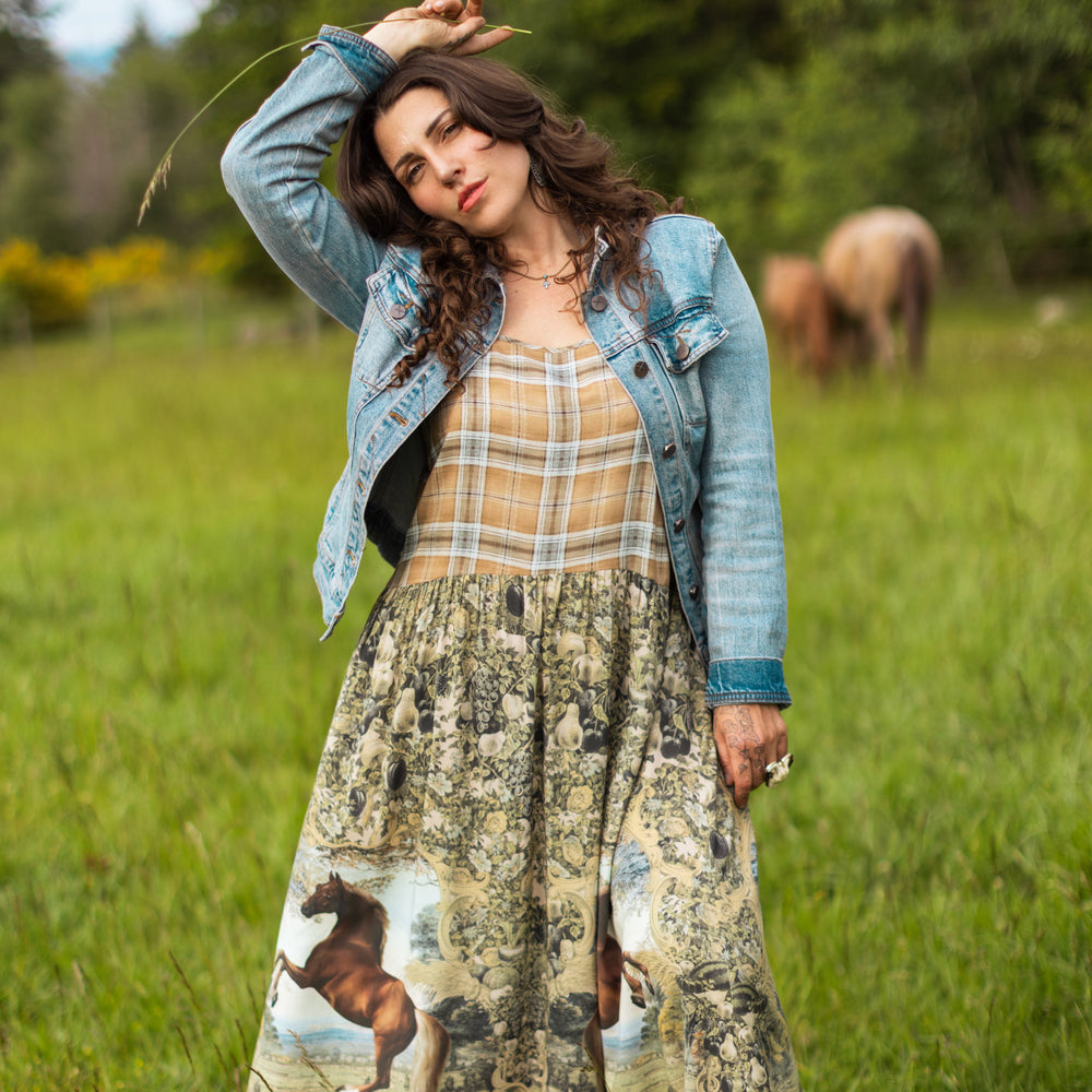 
                  
                    Model wearing a bamboo-viscose maxi-length slip dress made for everyday adventures with a whimsical print celebrating one's unbridled spirit of adventure - Market of Stars
                  
                