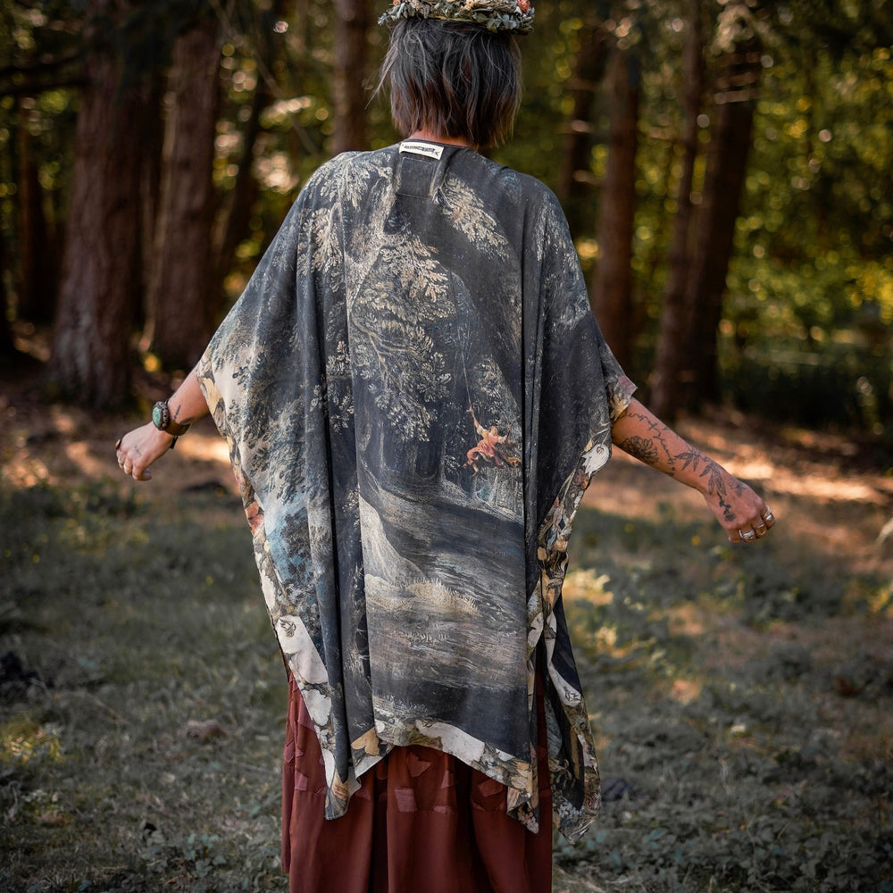 Castles in the Air Starduster kimono featuring Brueghel’s 1600s landscape, classical ruins, and joyful swing scene on bamboo-based viscose – Market of Stars.