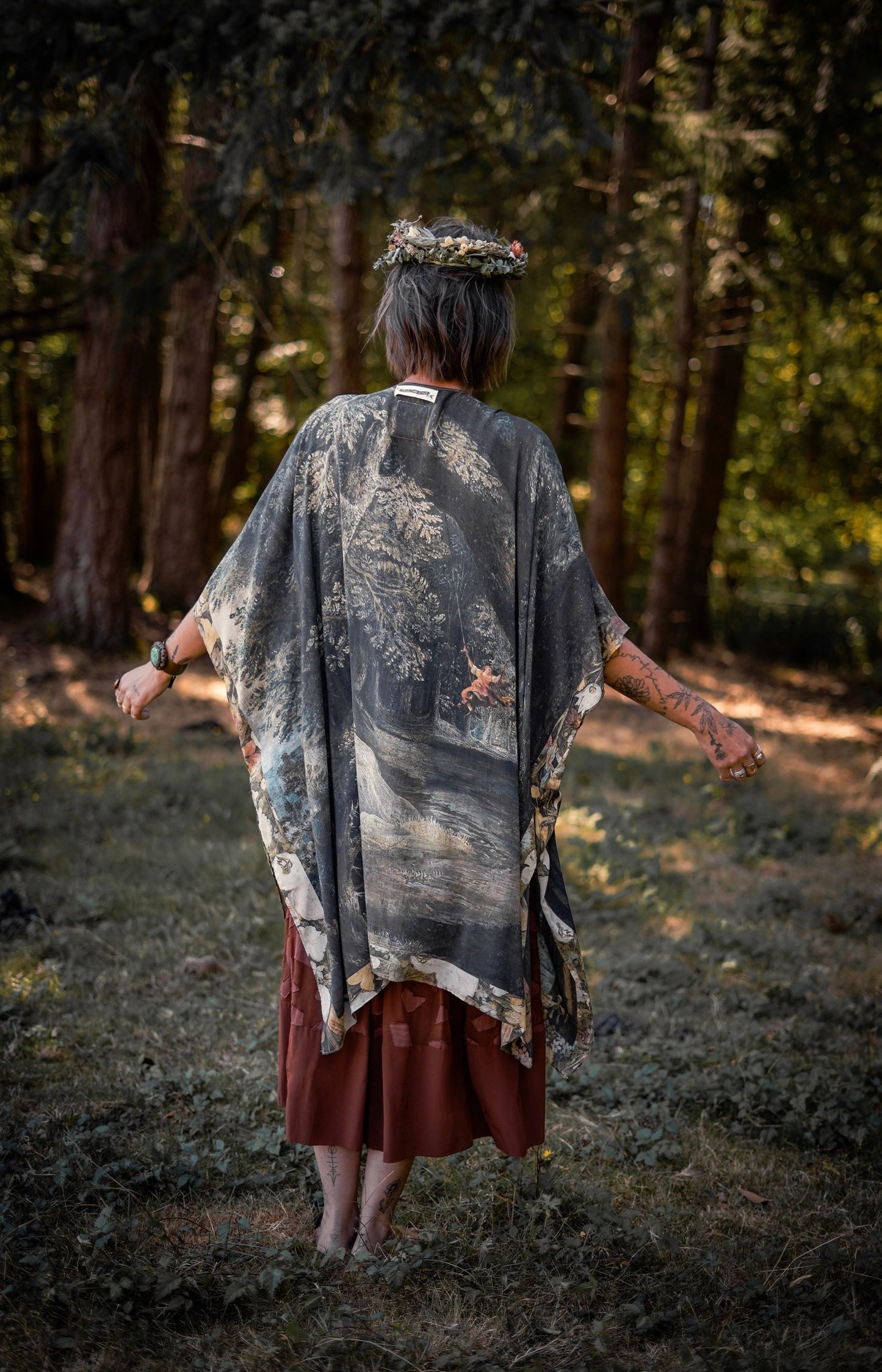 Castles in the Air Starduster kimono featuring Brueghel’s 1600s landscape, classical ruins, and joyful swing scene on bamboo-based viscose – Market of Stars.