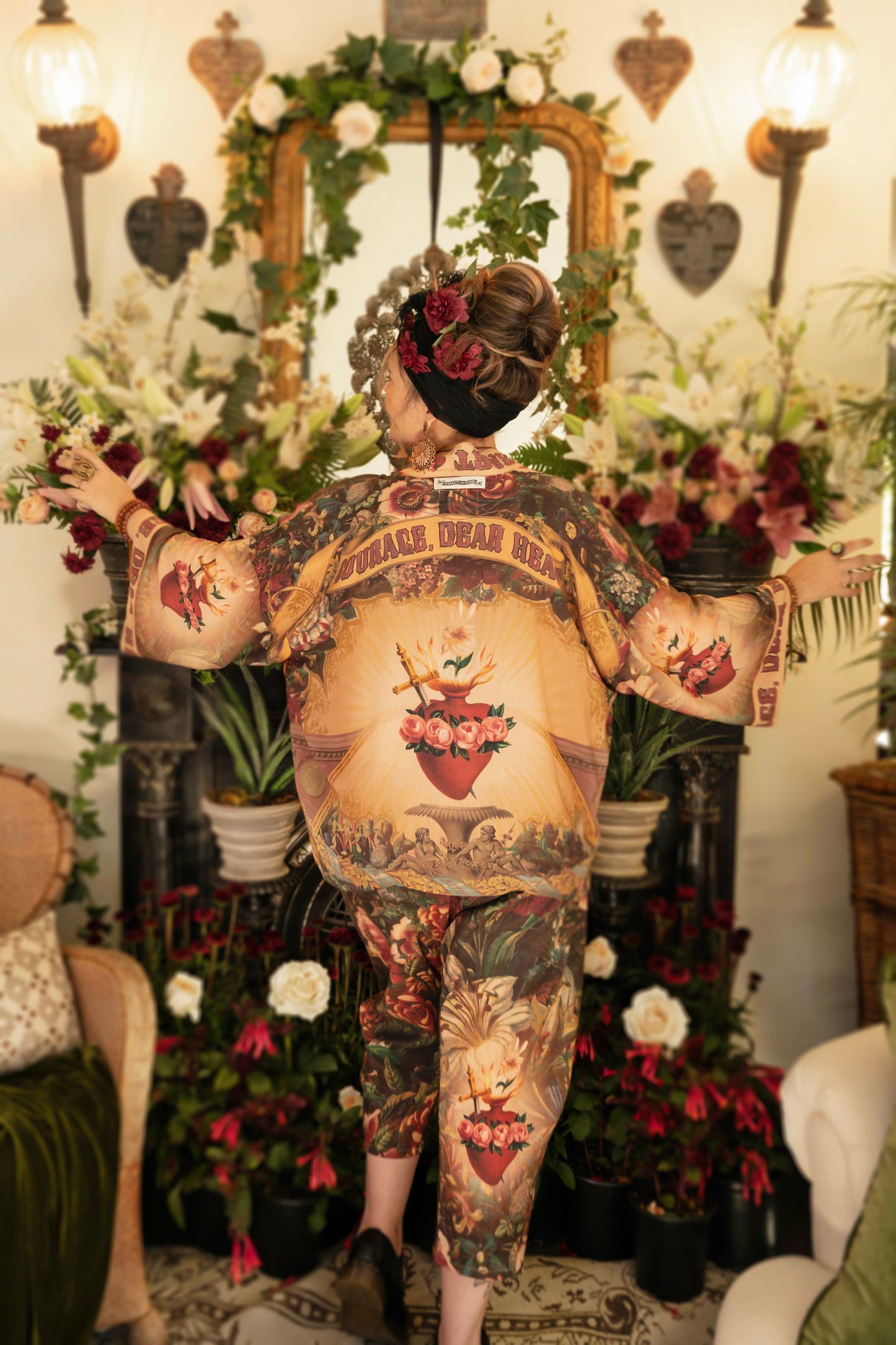 Model wearing Courage Dear Heart Pixie cut Duster featuring Victorian Sacred Heart art and hidden affirmations of courage and love on bamboo-based viscose – Market of Stars.