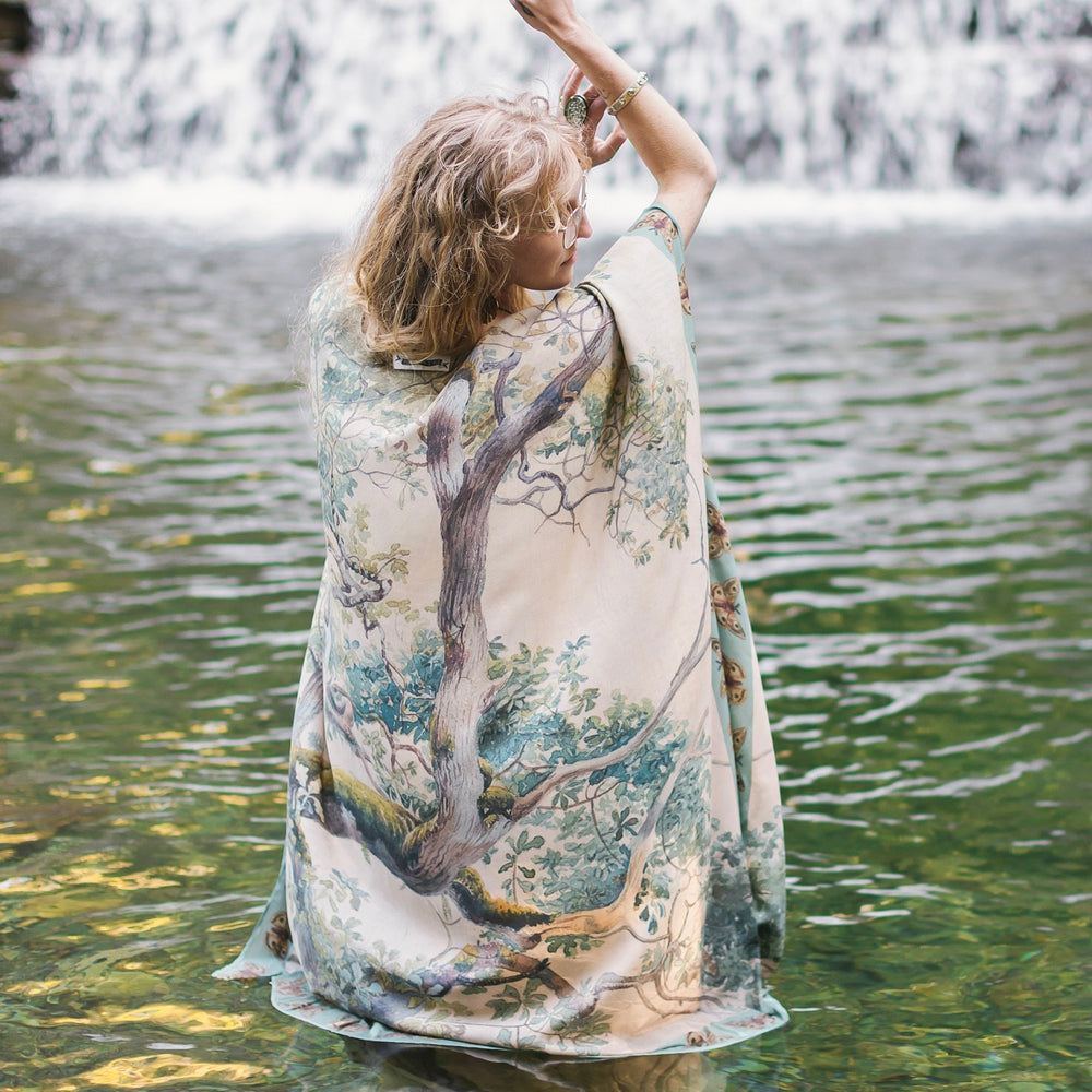 Model wearing the Earth and Sky Goddess length kimono featuring majestic trees by Charles Aston and antique moth illustrations – a dreamy tribute to nature – Market of Stars.