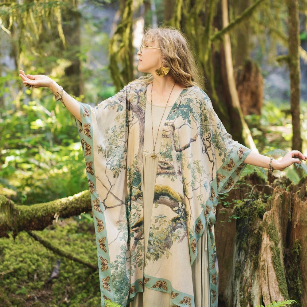 Model wearing the Earth and Sky Goddess length kimono featuring majestic trees by Charles Aston and antique moth illustrations – a dreamy tribute to nature – Market of Stars.