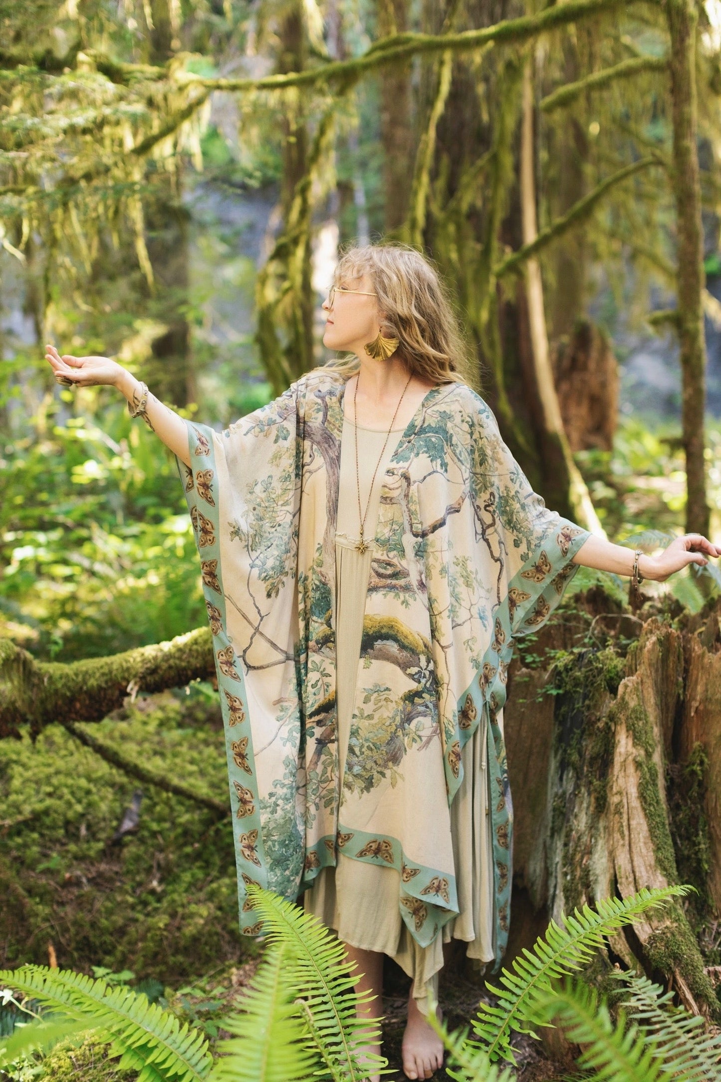 Model wearing the Earth and Sky Goddess length kimono featuring majestic trees by Charles Aston and antique moth illustrations – a dreamy tribute to nature – Market of Stars.