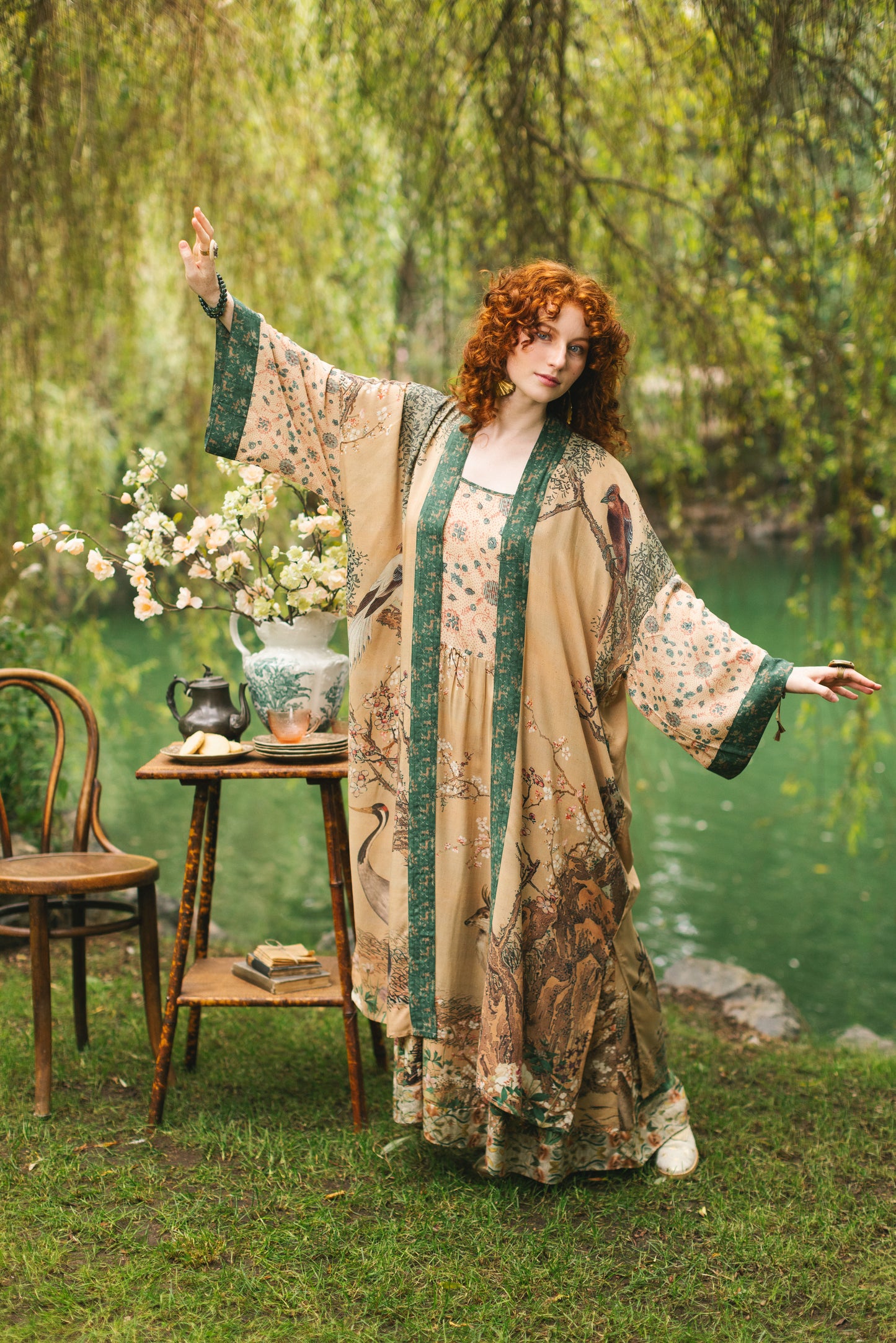 Model wearing Fable Opera Duster featuring antique Japanese art, cherry and peach blossoms, nightingales, deer, and French block prints - Market of Stars