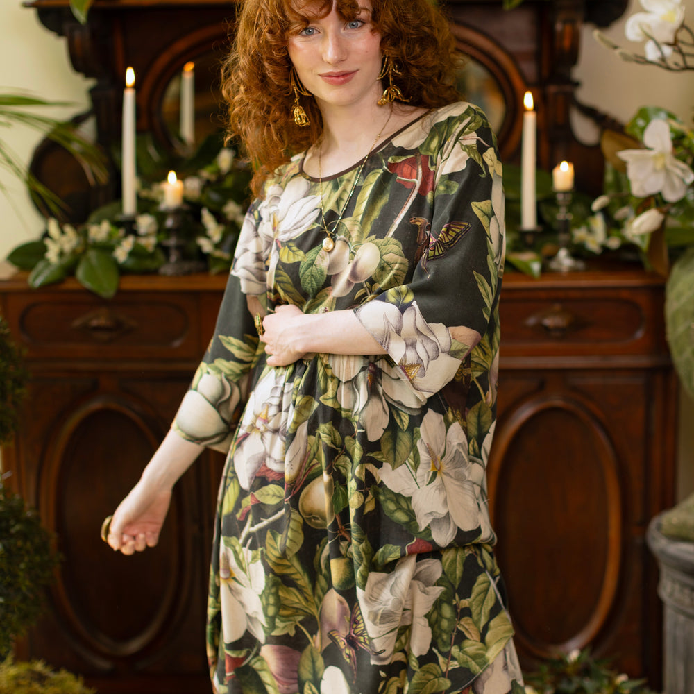 
                  
                    Model wearing Fleur De Lune Artist Dress featuring vintage magnolia lithographs, delicate moth etchings and bumblebee detail - inspired by the French chemise - Market of Stars
                  
                