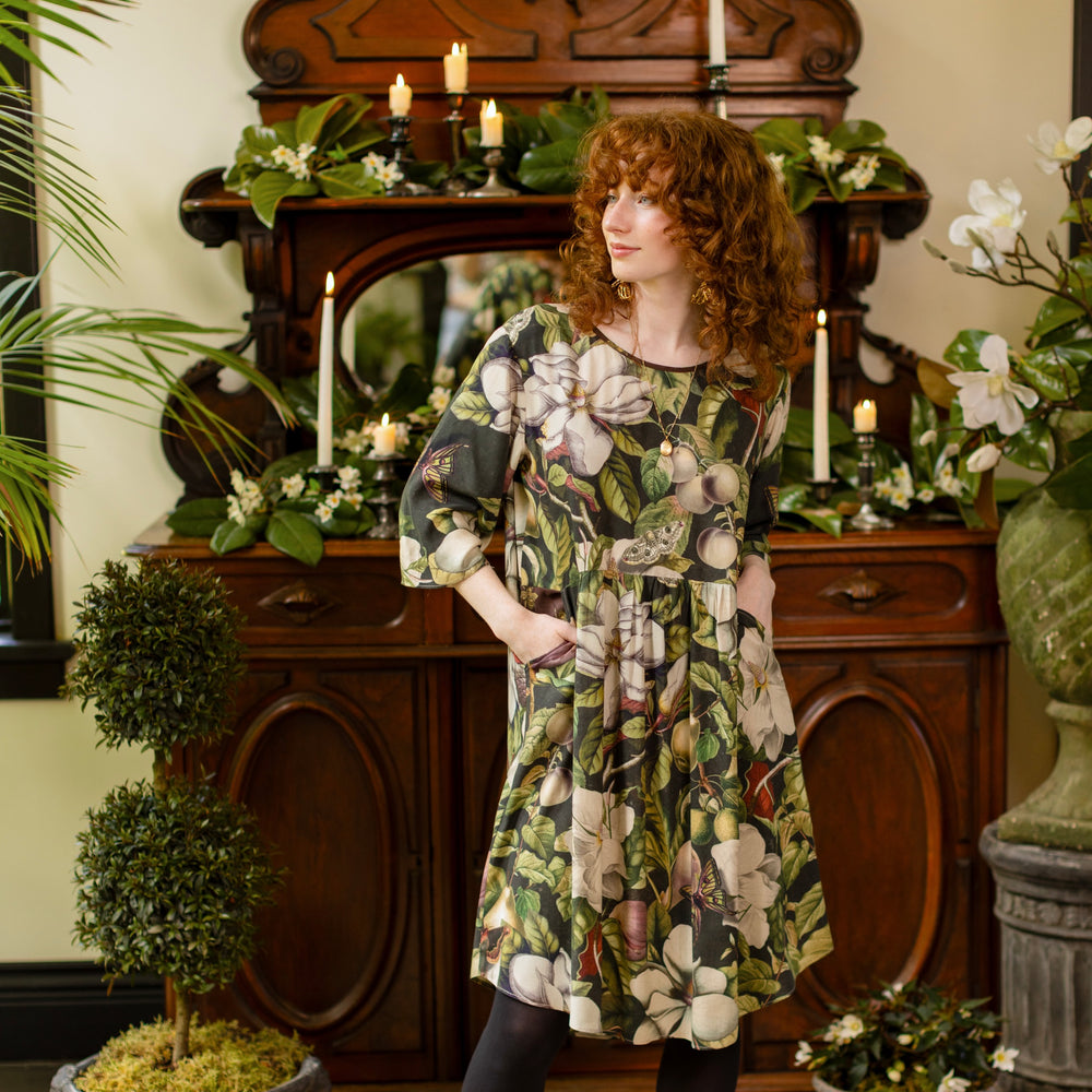 
                  
                    Model wearing Fleur De Lune Artist Dress featuring vintage magnolia lithographs, delicate moth etchings and bumblebee detail - inspired by the French chemise - Market of Stars
                  
                