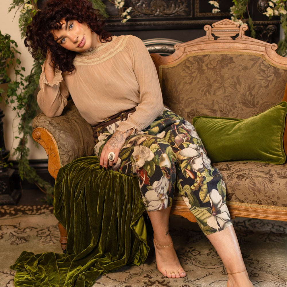 
                  
                    Model wearing Fleur De Lune Artist Pants with lantern-hem silhouette featuring antique magnolia lithographs, delicate moth etchings, and charming bumblebee trim - Market of Stars
                  
                