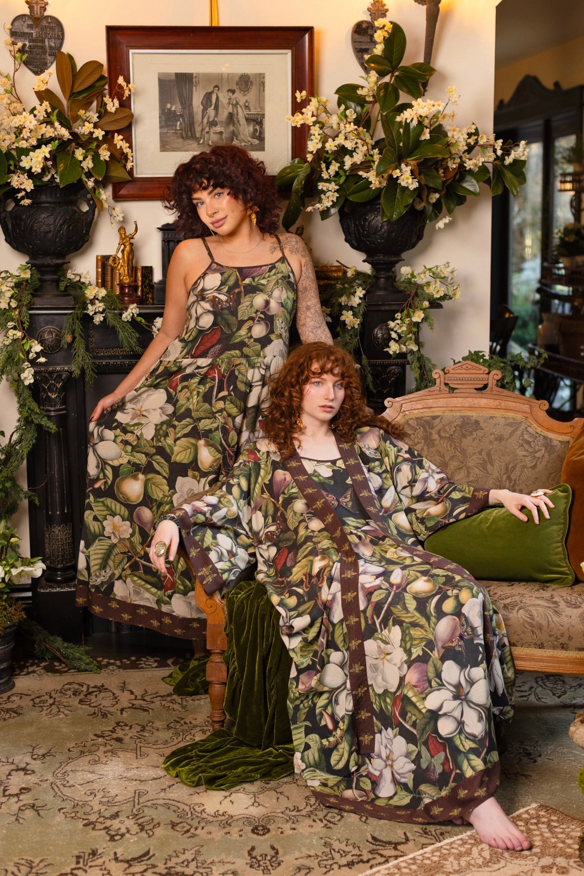 Model wearing a maxi-length slip dress featuring vintage magnolia lithographs, delicate moth etchings, and charming bumblebee trim - Market of Stars