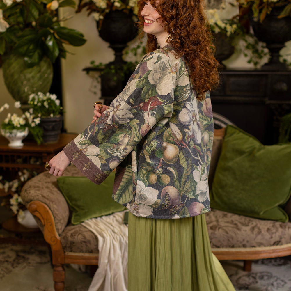 
                  
                    Model wearing a cozy cardigan lined with fleece featuring vintage magnolia lithographs, delicate moth etchings, and charming bumblebee trim - Market of stars
                  
                
