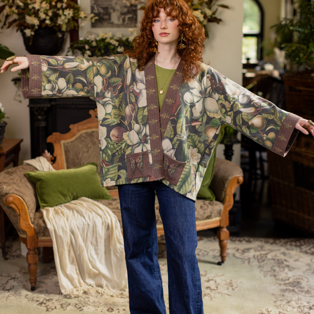 
                  
                    Model wearing a cozy cardigan lined with fleece featuring vintage magnolia lithographs, delicate moth etchings, and charming bumblebee trim - Market of stars
                  
                