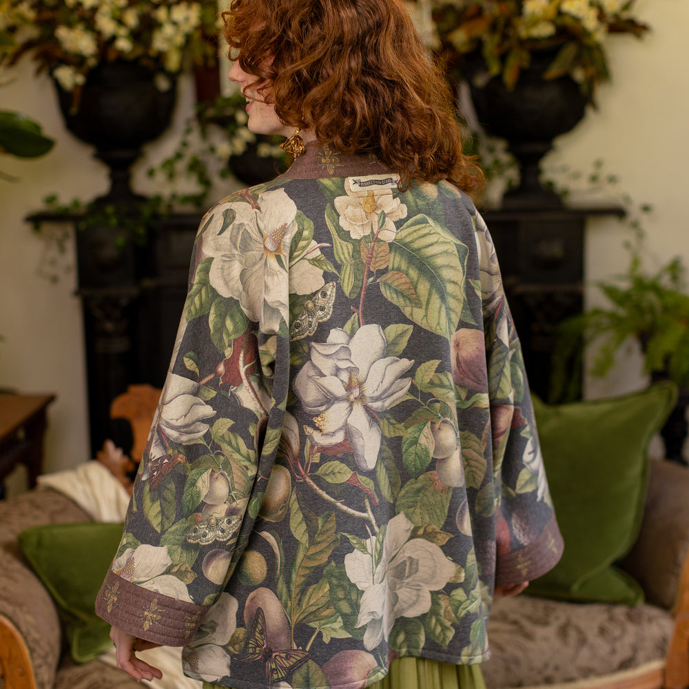 
                  
                    Model wearing a cozy cardigan lined with fleece featuring vintage magnolia lithographs, delicate moth etchings, and charming bumblebee trim - Market of stars
                  
                