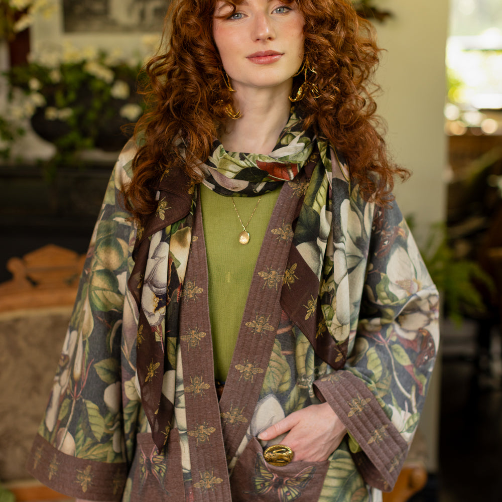 
                  
                    Model wearing a cozy cardigan lined with fleece featuring vintage magnolia lithographs, delicate moth etchings, and charming bumblebee trim - Market of stars
                  
                