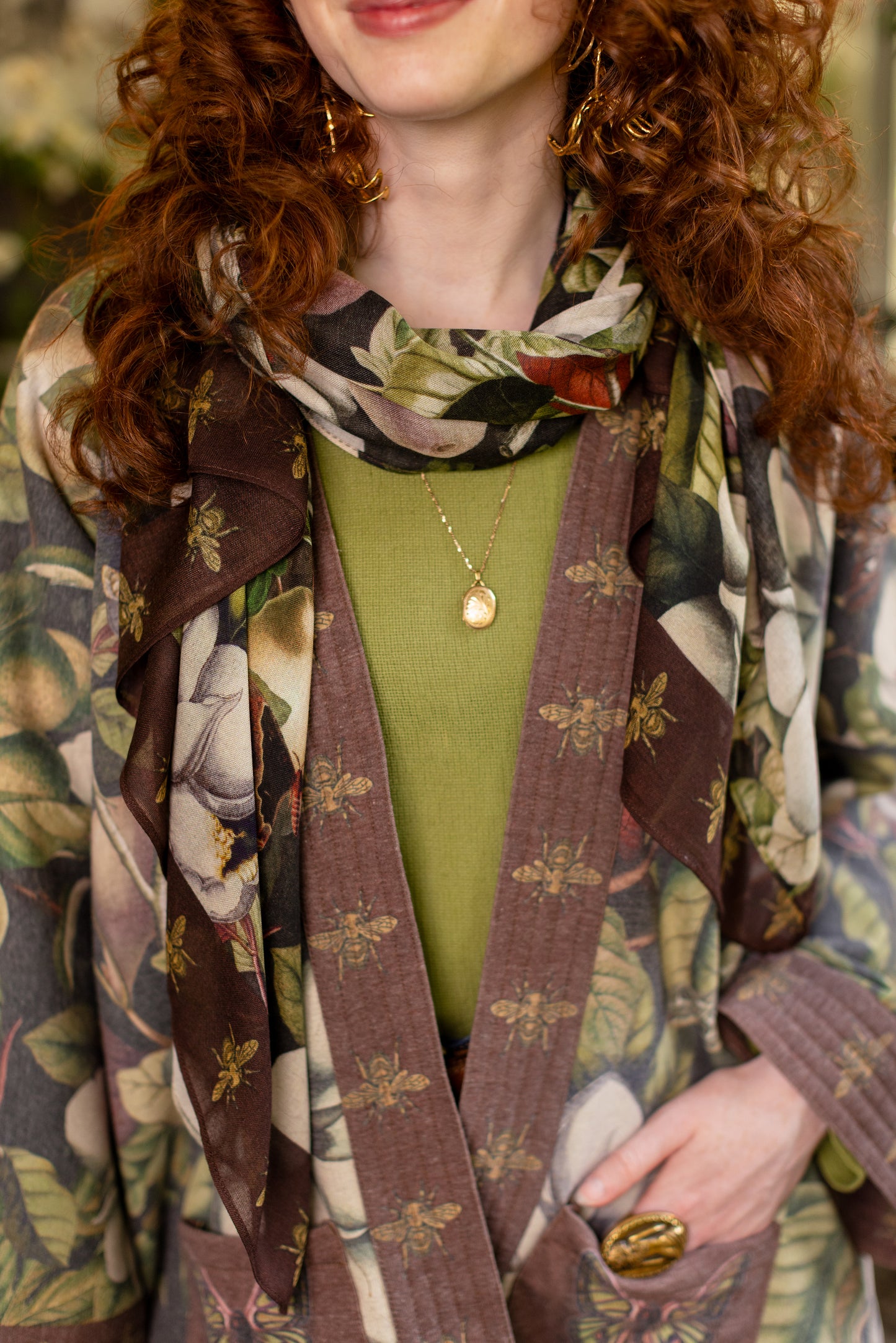 Model wearing a cozy cardigan lined with fleece featuring vintage magnolia lithographs, delicate moth etchings, and charming bumblebee trim - Market of stars