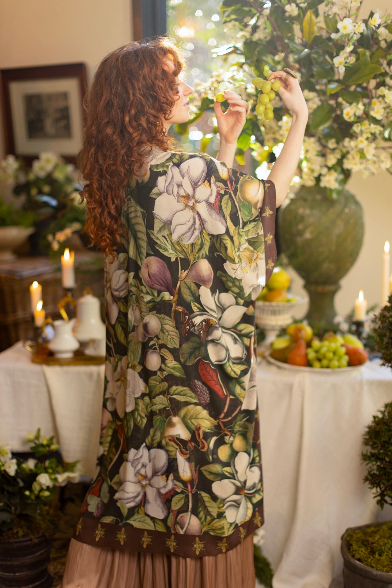 Model wearing a flowy kimono duster featuring vintage magnolia lithographs, delicate moth etchings, and charming bumblebee trim - Market of Stars