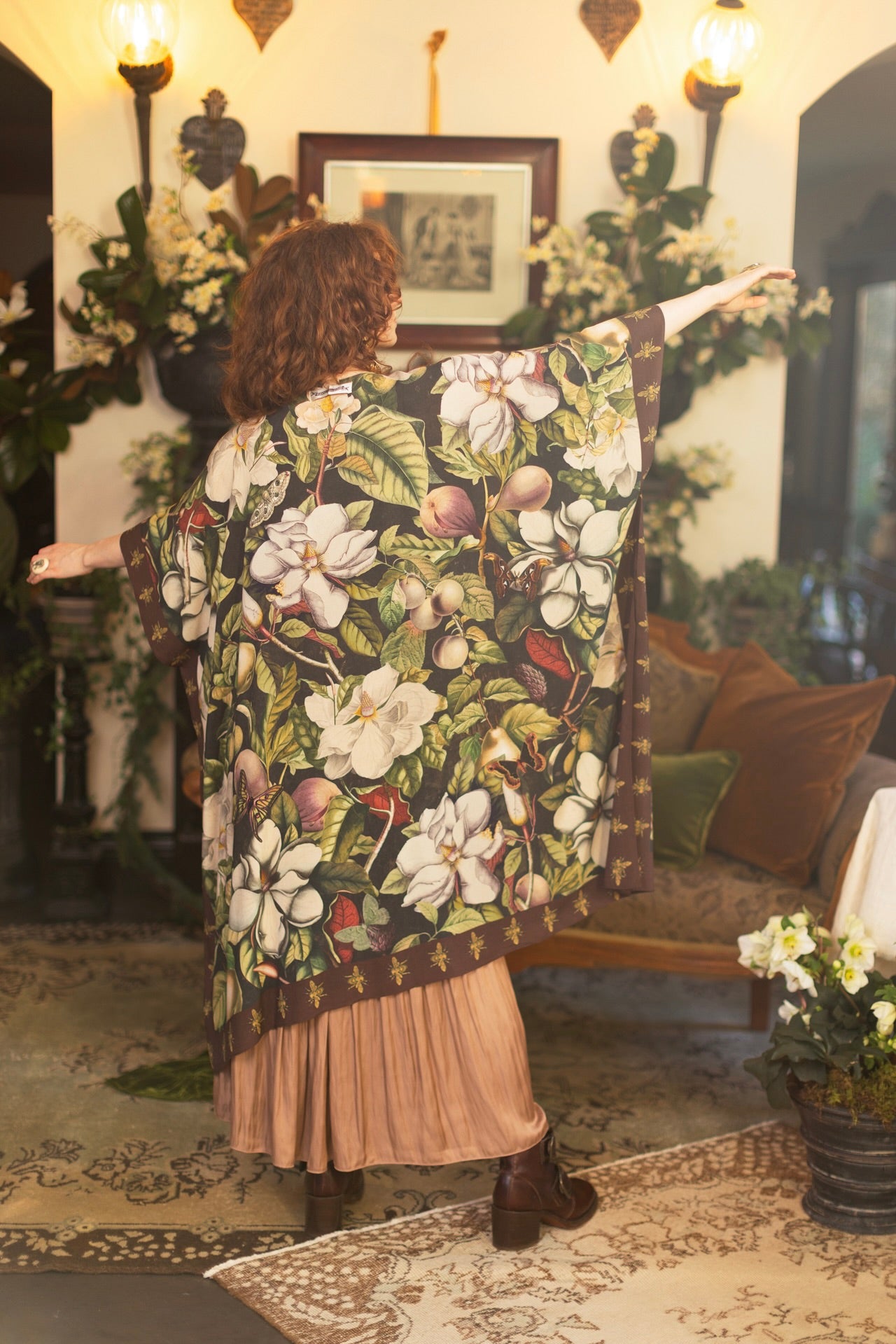 Model wearing a flowy kimono duster featuring vintage magnolia lithographs, delicate moth etchings, and charming bumblebee trim - Market of Stars