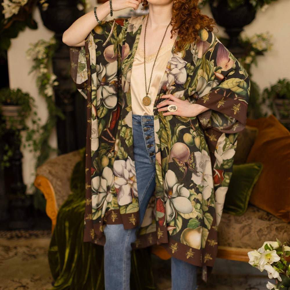 
                  
                    Model wearing a flowy kimono duster featuring vintage magnolia lithographs, delicate moth etchings, and charming bumblebee trim - Market of Stars
                  
                