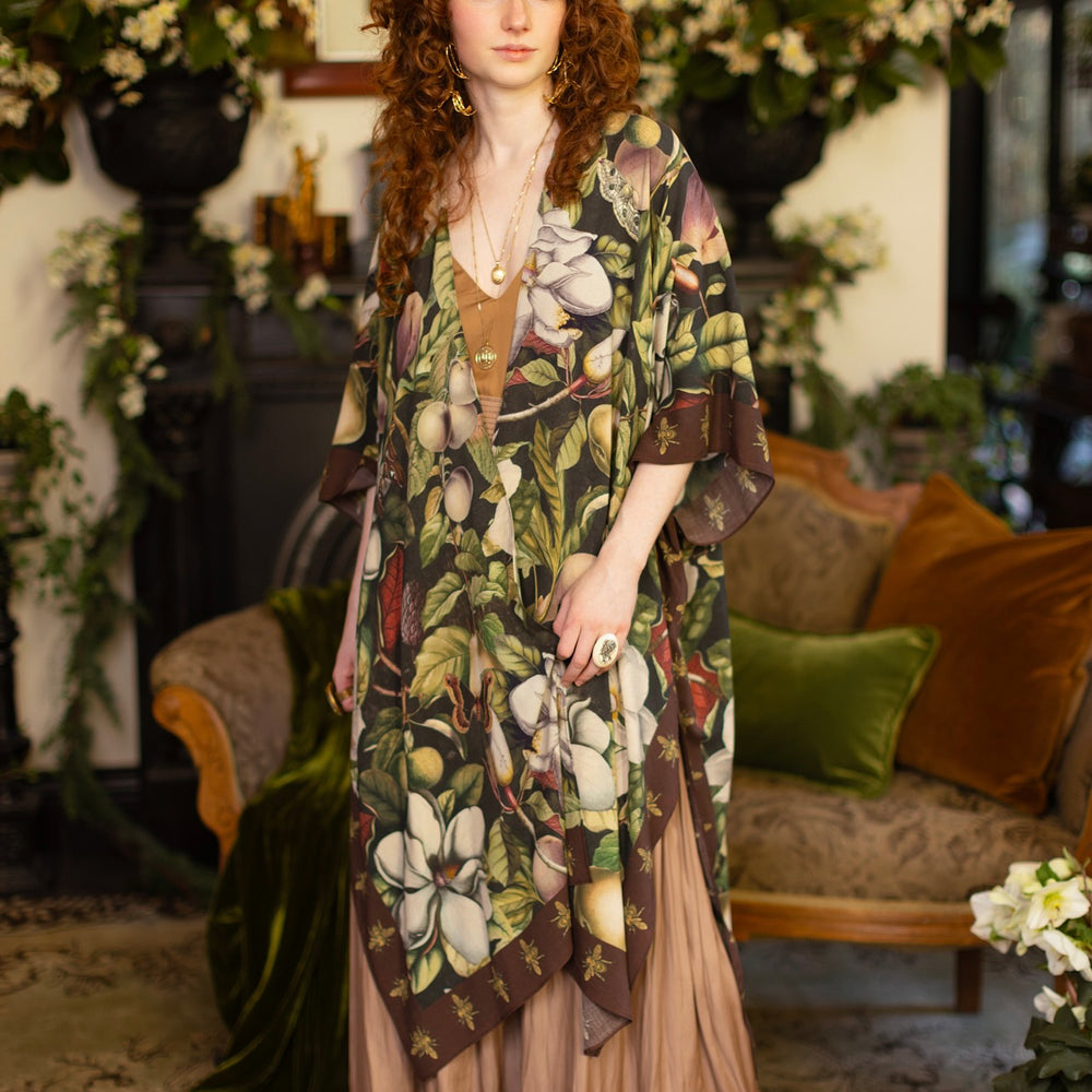 
                  
                    Model wearing a flowy kimono duster featuring vintage magnolia lithographs, delicate moth etchings, and charming bumblebee trim - Market of Stars
                  
                
