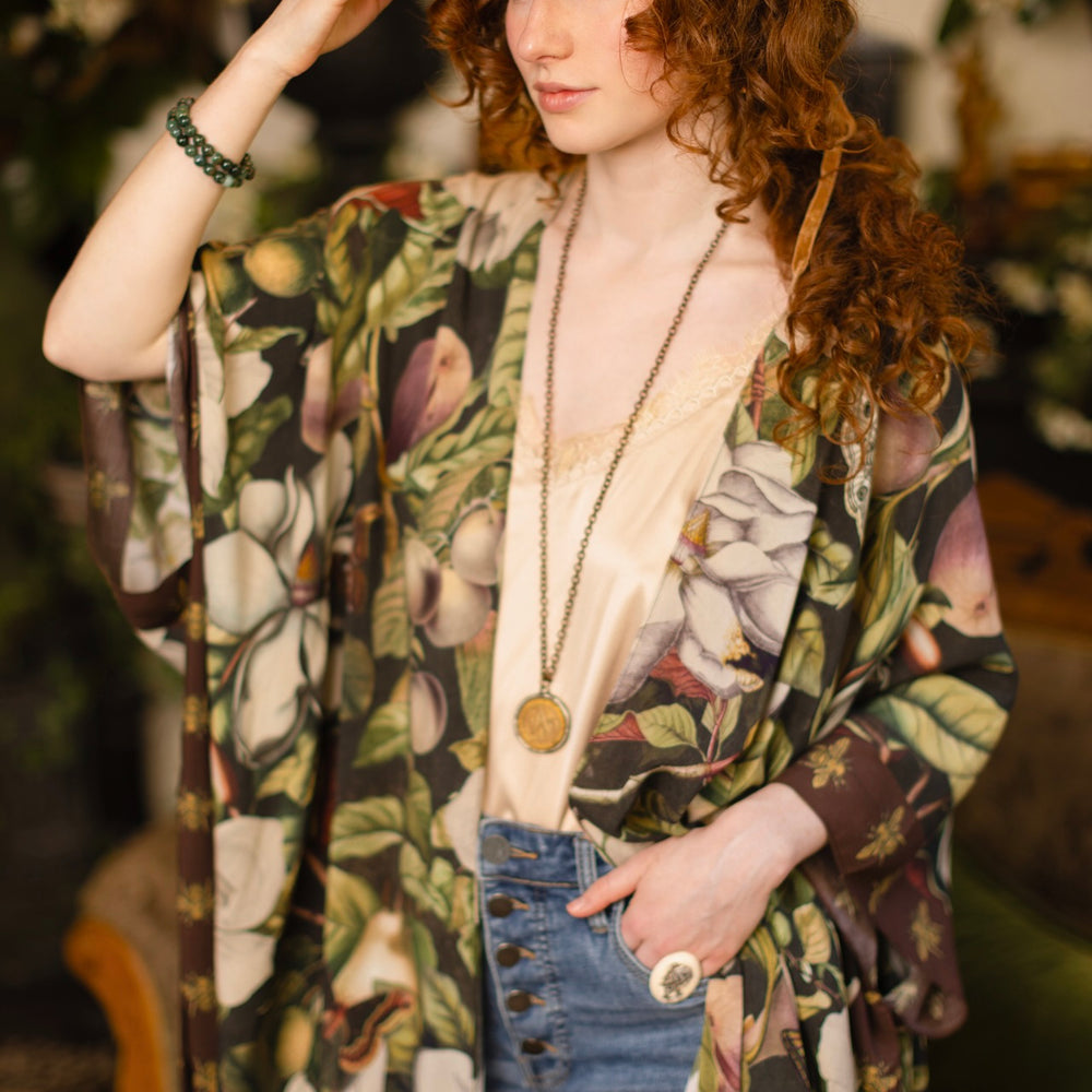 
                  
                    Model wearing a flowy kimono duster featuring vintage magnolia lithographs, delicate moth etchings, and charming bumblebee trim - Market of Stars
                  
                