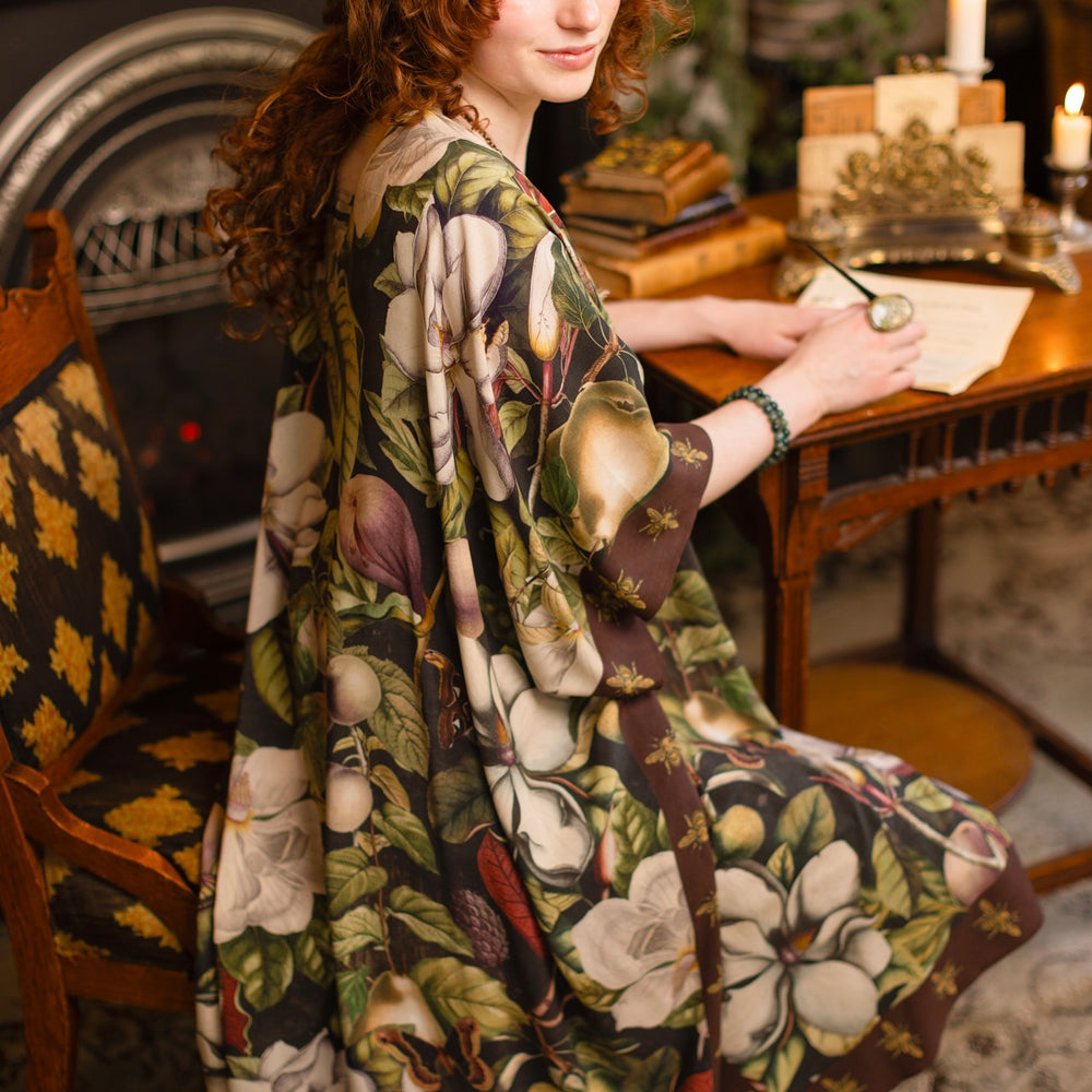 
                  
                    Model wearing a flowy kimono duster featuring vintage magnolia lithographs, delicate moth etchings, and charming bumblebee trim - Market of Stars
                  
                