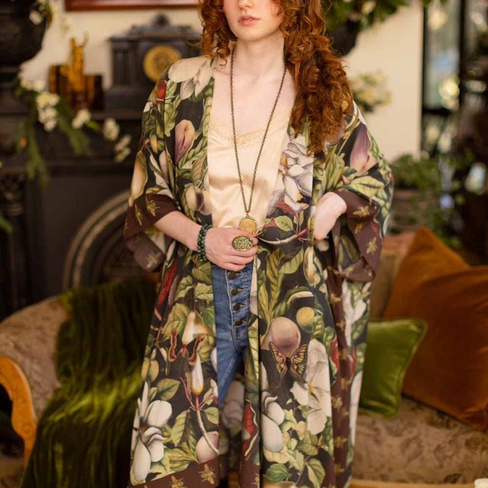 
                  
                    Model wearing a flowy kimono duster featuring vintage magnolia lithographs, delicate moth etchings, and charming bumblebee trim - Market of Stars
                  
                
