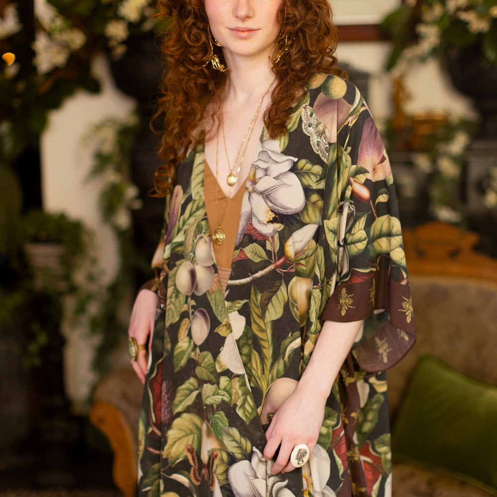 
                  
                    Model wearing a flowy kimono duster featuring vintage magnolia lithographs, delicate moth etchings, and charming bumblebee trim - Market of Stars
                  
                