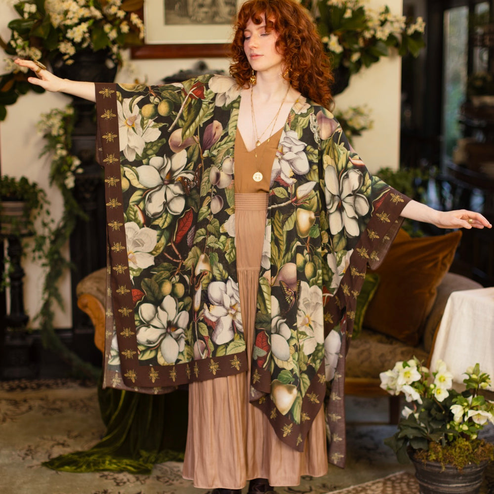 
                  
                    Model wearing a flowy kimono duster featuring vintage magnolia lithographs, delicate moth etchings, and charming bumblebee trim - Market of Stars
                  
                