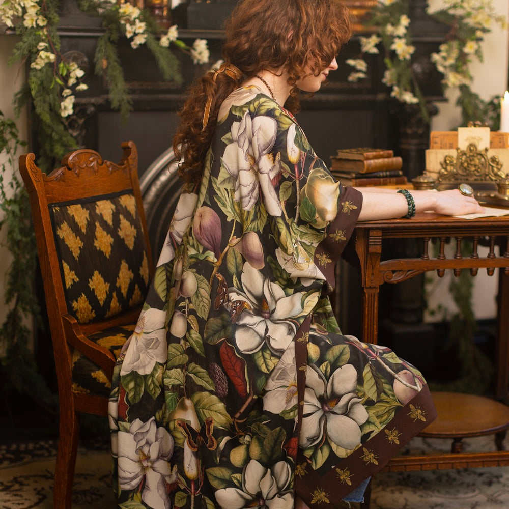 
                  
                    Model wearing a flowy kimono duster featuring vintage magnolia lithographs, delicate moth etchings, and charming bumblebee trim - Market of Stars
                  
                