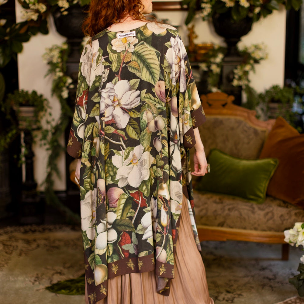 
                  
                    Model wearing a flowy kimono duster featuring vintage magnolia lithographs, delicate moth etchings, and charming bumblebee trim - Market of Stars
                  
                