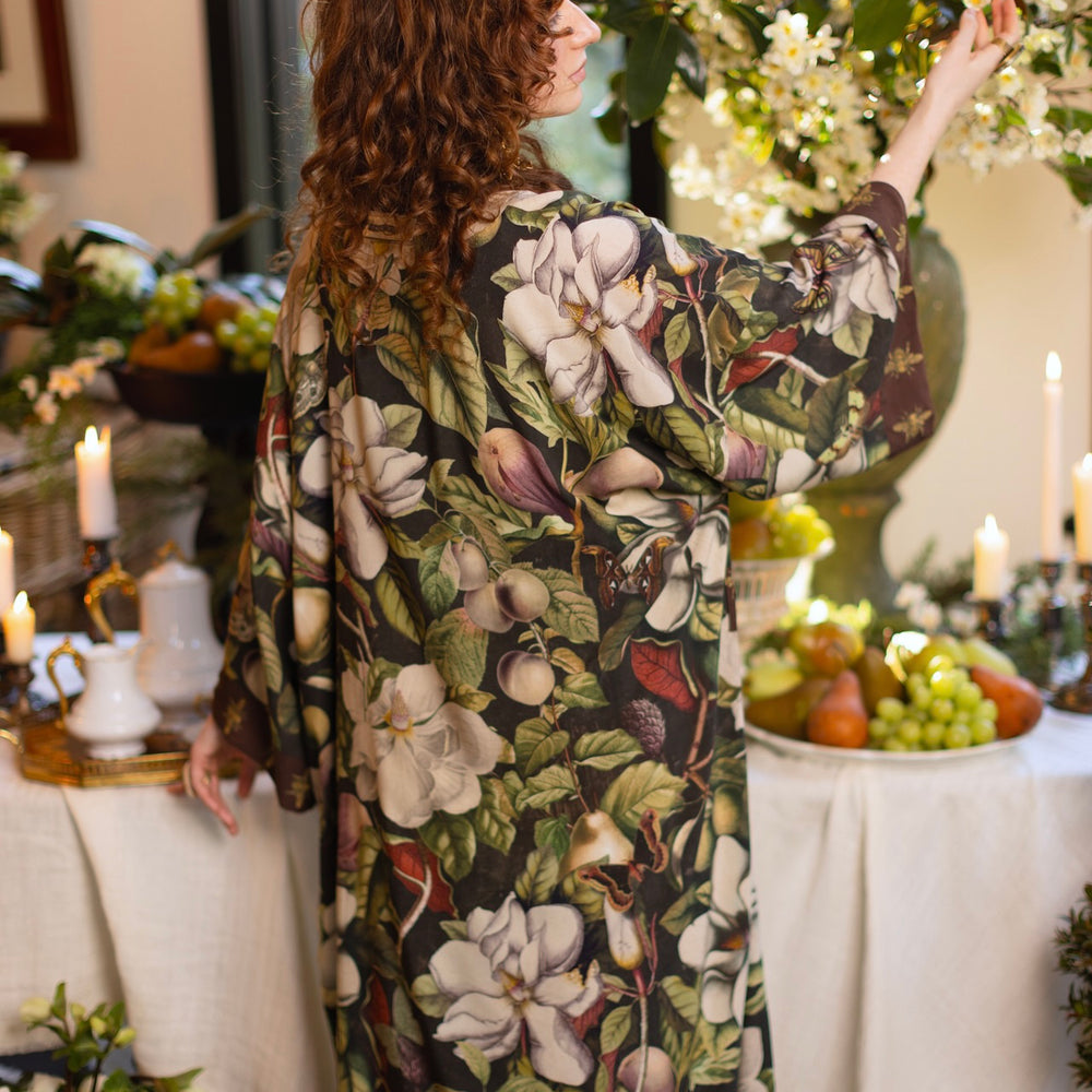 
                  
                    Model wearing a full length kimono duster robe featuring vintage magnolia lithographs, delicate moth etchings, and charming bumblebee trim - Market of Stars
                  
                