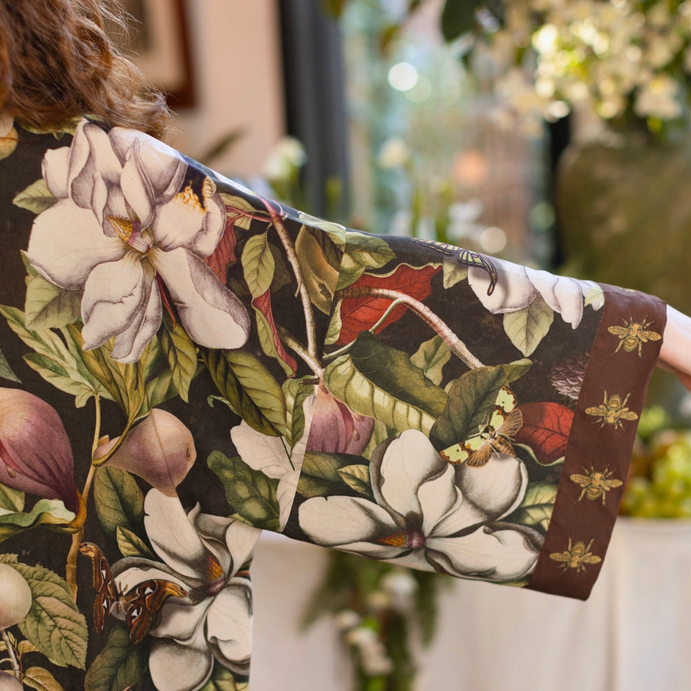 
                  
                    Model wearing a full length kimono duster robe featuring vintage magnolia lithographs, delicate moth etchings, and charming bumblebee trim - Market of Stars
                  
                