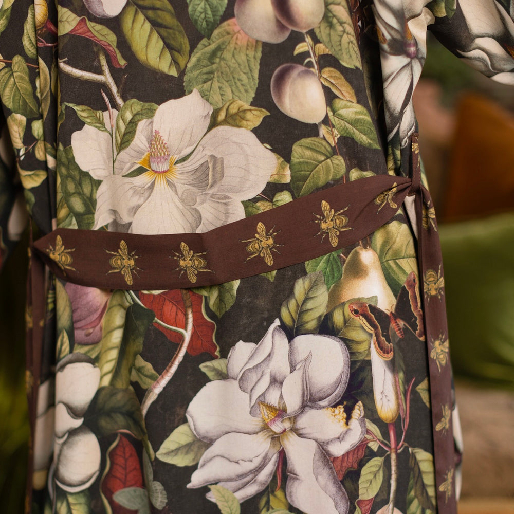 
                  
                    Model wearing a full length kimono duster robe featuring vintage magnolia lithographs, delicate moth etchings, and charming bumblebee trim - Market of Stars
                  
                
