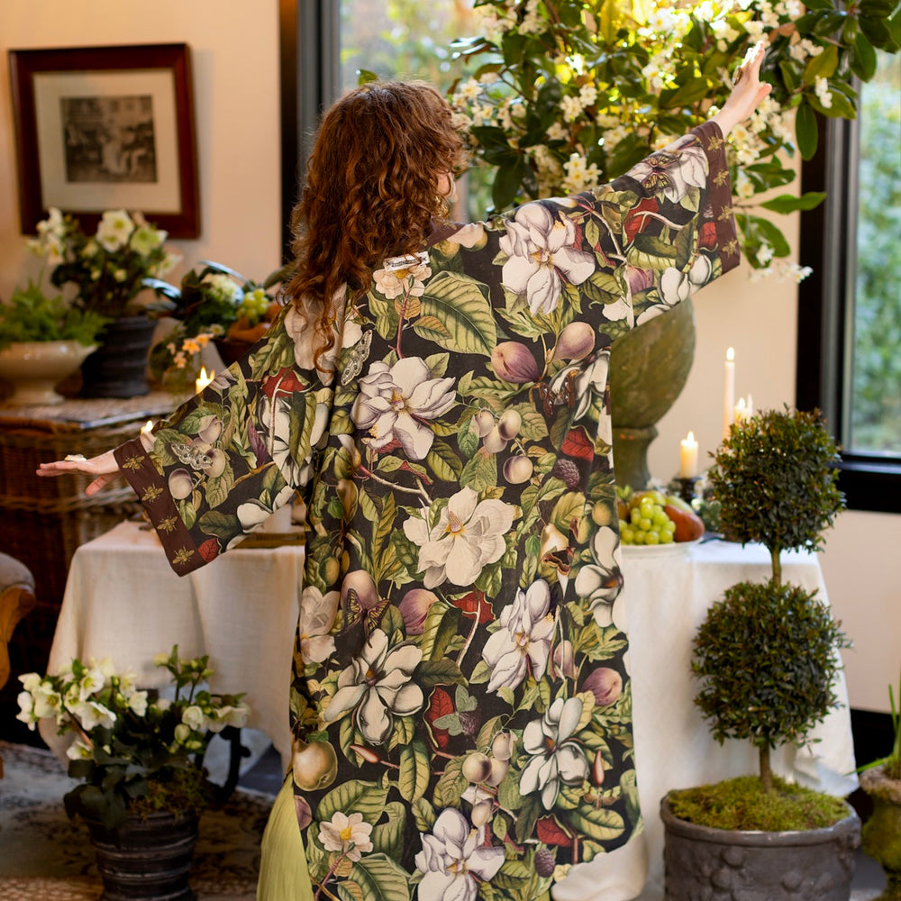 
                  
                    Model wearing a full length kimono duster robe featuring vintage magnolia lithographs, delicate moth etchings, and charming bumblebee trim - Market of Stars
                  
                