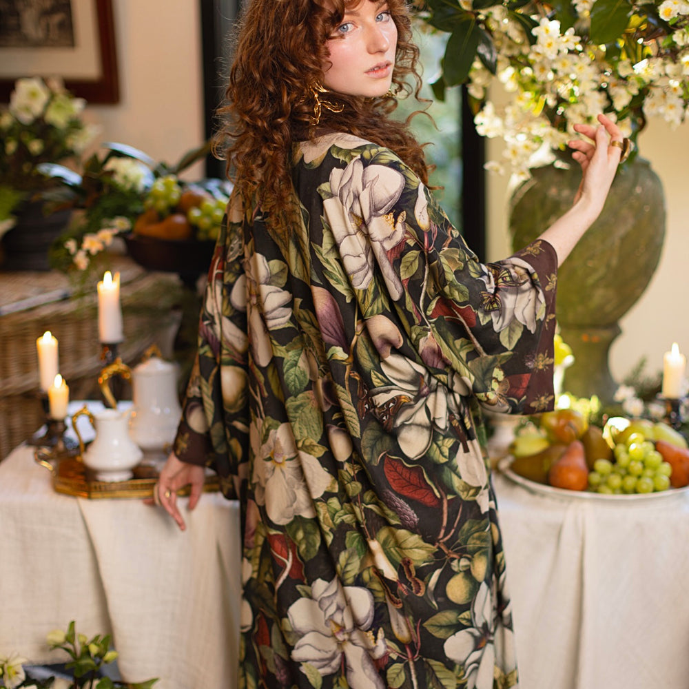 
                  
                    Model wearing a full length kimono duster robe featuring vintage magnolia lithographs, delicate moth etchings, and charming bumblebee trim - Market of Stars
                  
                
