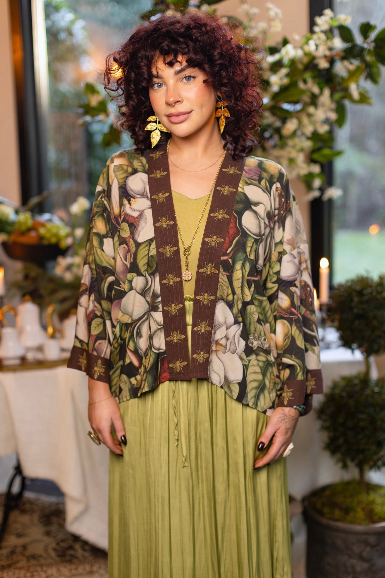 Model wearing a cropped kimono duster featuring vintage magnolia lithographs, delicate moth etchings, and charming bumblebee trim - Market of Stars