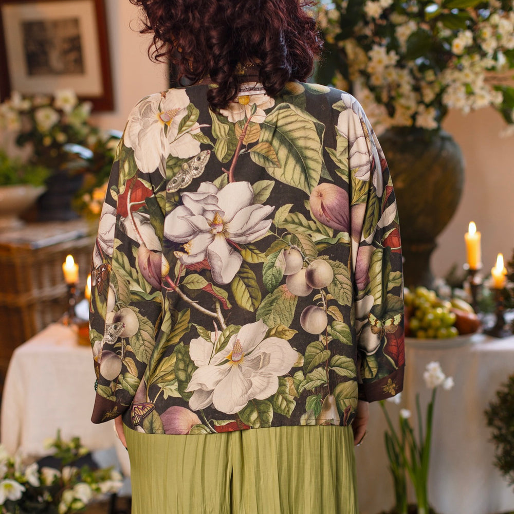 Model wearing a cropped kimono duster featuring vintage magnolia lithographs, delicate moth etchings, and charming bumblebee trim - Market of Stars
