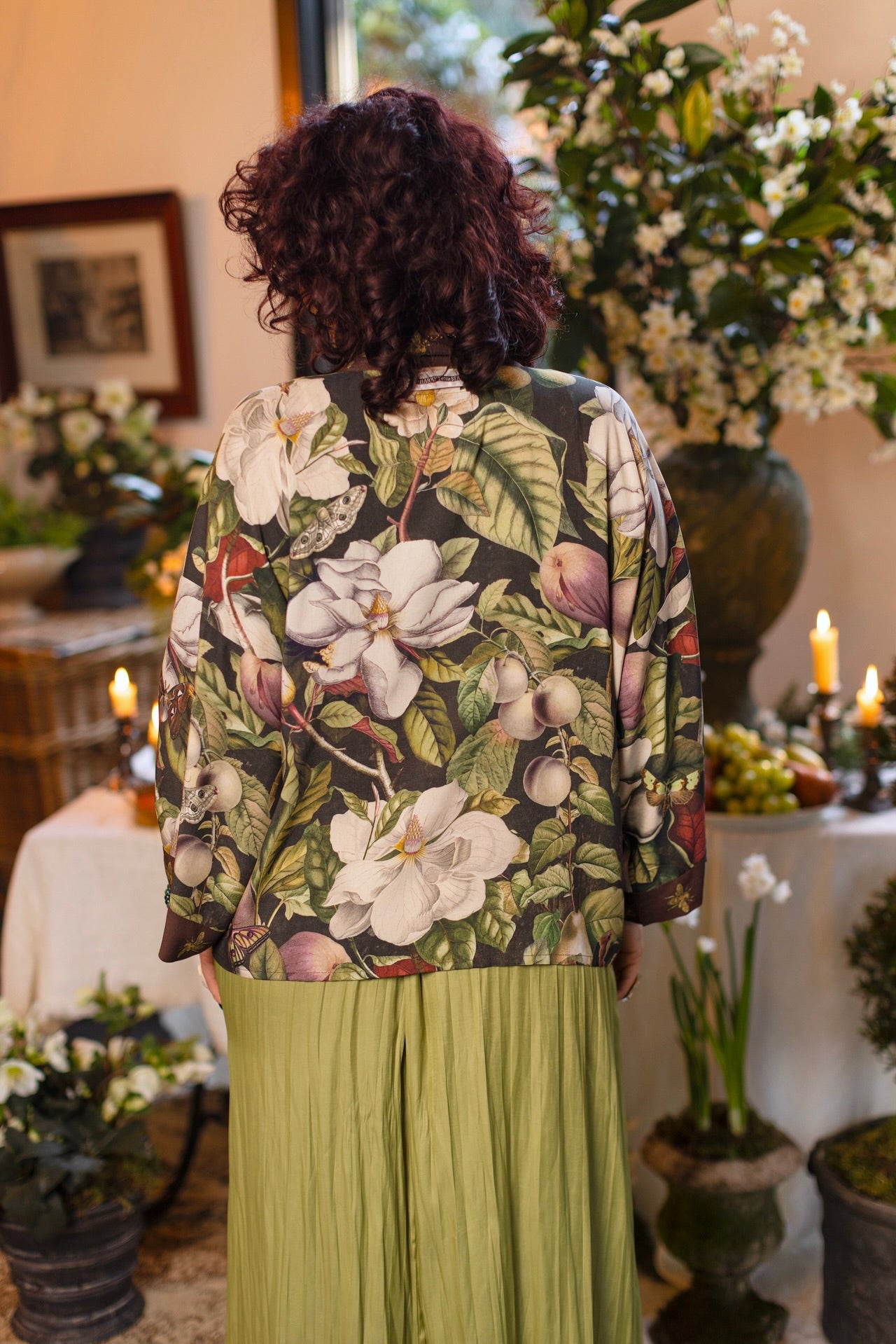 Model wearing a cropped kimono duster featuring vintage magnolia lithographs, delicate moth etchings, and charming bumblebee trim - Market of Stars