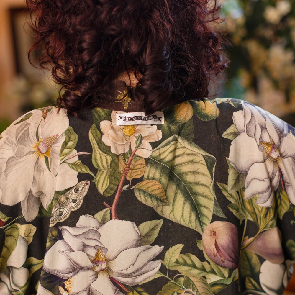 
                  
                    Model wearing a cropped kimono duster featuring vintage magnolia lithographs, delicate moth etchings, and charming bumblebee trim - Market of Stars
                  
                