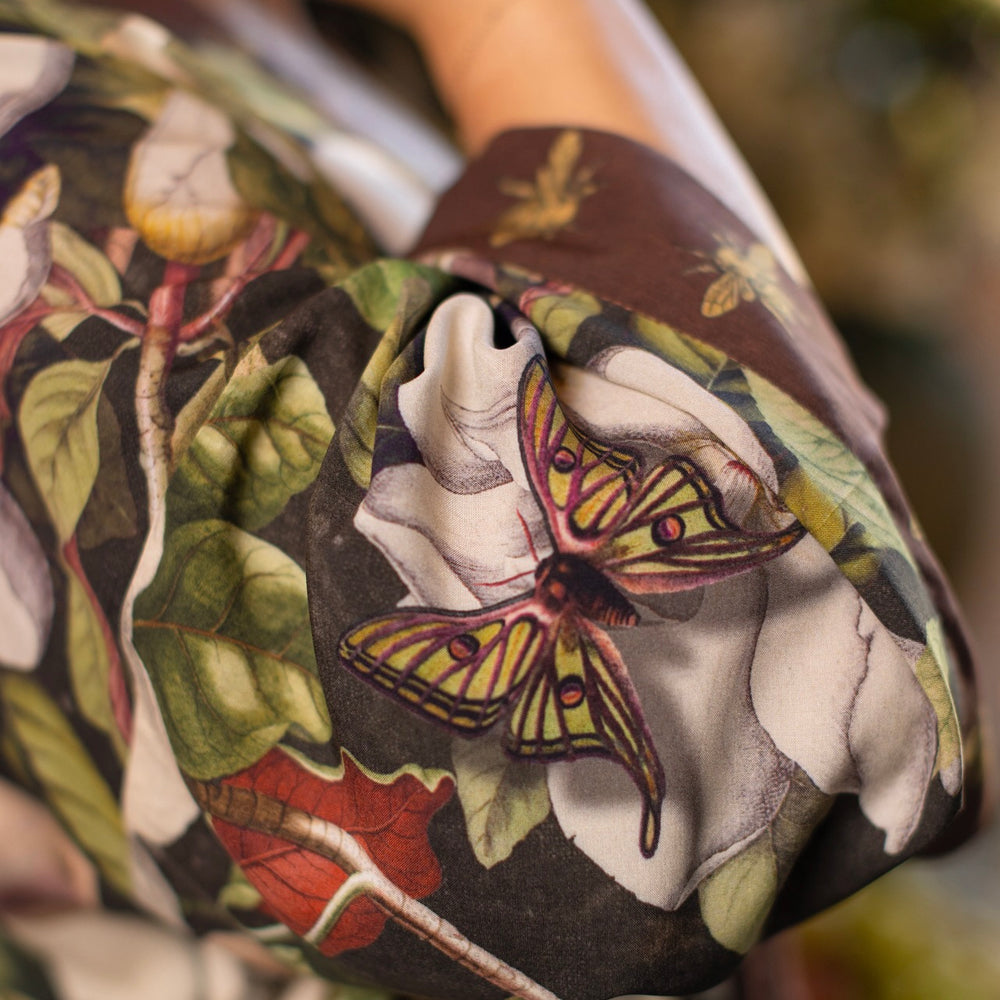 
                  
                    Model wearing a cropped kimono duster featuring vintage magnolia lithographs, delicate moth etchings, and charming bumblebee trim - Market of Stars
                  
                