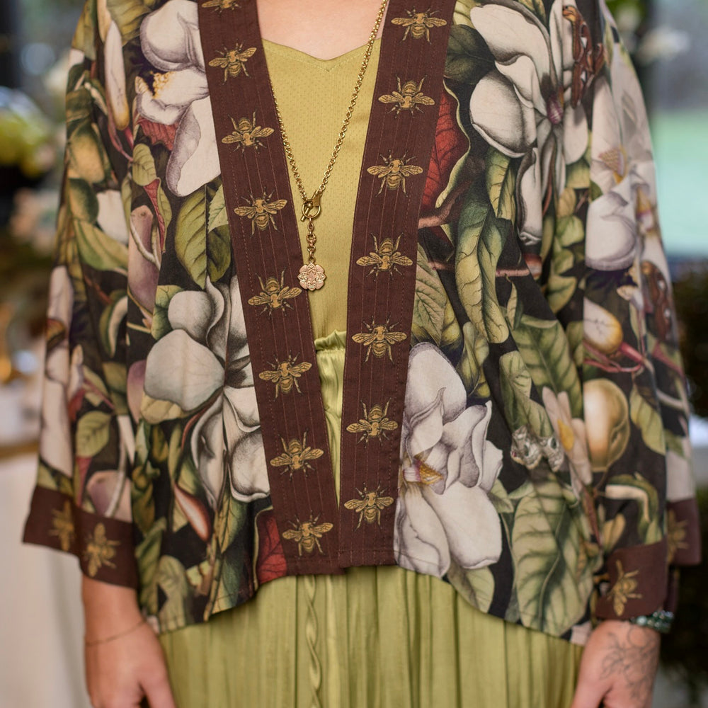 
                  
                    Model wearing a cropped kimono duster featuring vintage magnolia lithographs, delicate moth etchings, and charming bumblebee trim - Market of Stars
                  
                