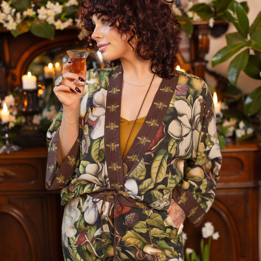 
                  
                    Model wearing a cropped kimono duster featuring vintage magnolia lithographs, delicate moth etchings, and charming bumblebee trim - Market of Stars
                  
                