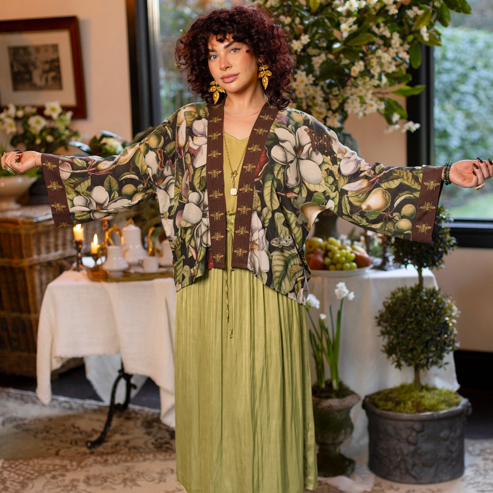 
                  
                    Model wearing a cropped kimono duster featuring vintage magnolia lithographs, delicate moth etchings, and charming bumblebee trim - Market of Stars
                  
                